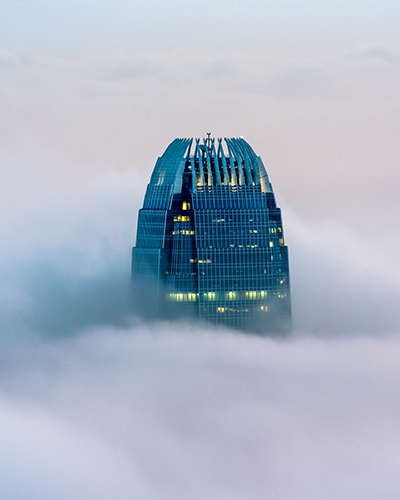 Photo of International Finance Centre in Hong Kong surrounded by mist.